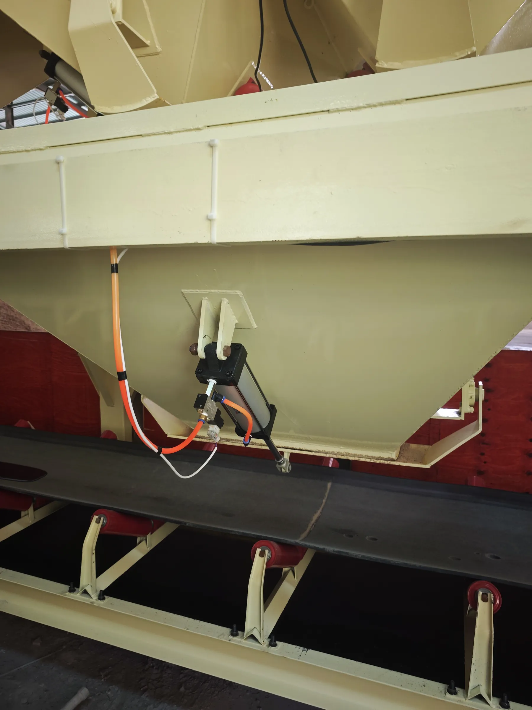 concrete equipment Ingredients gate, pneumatic mechanism, and conveyor belt details in real photos