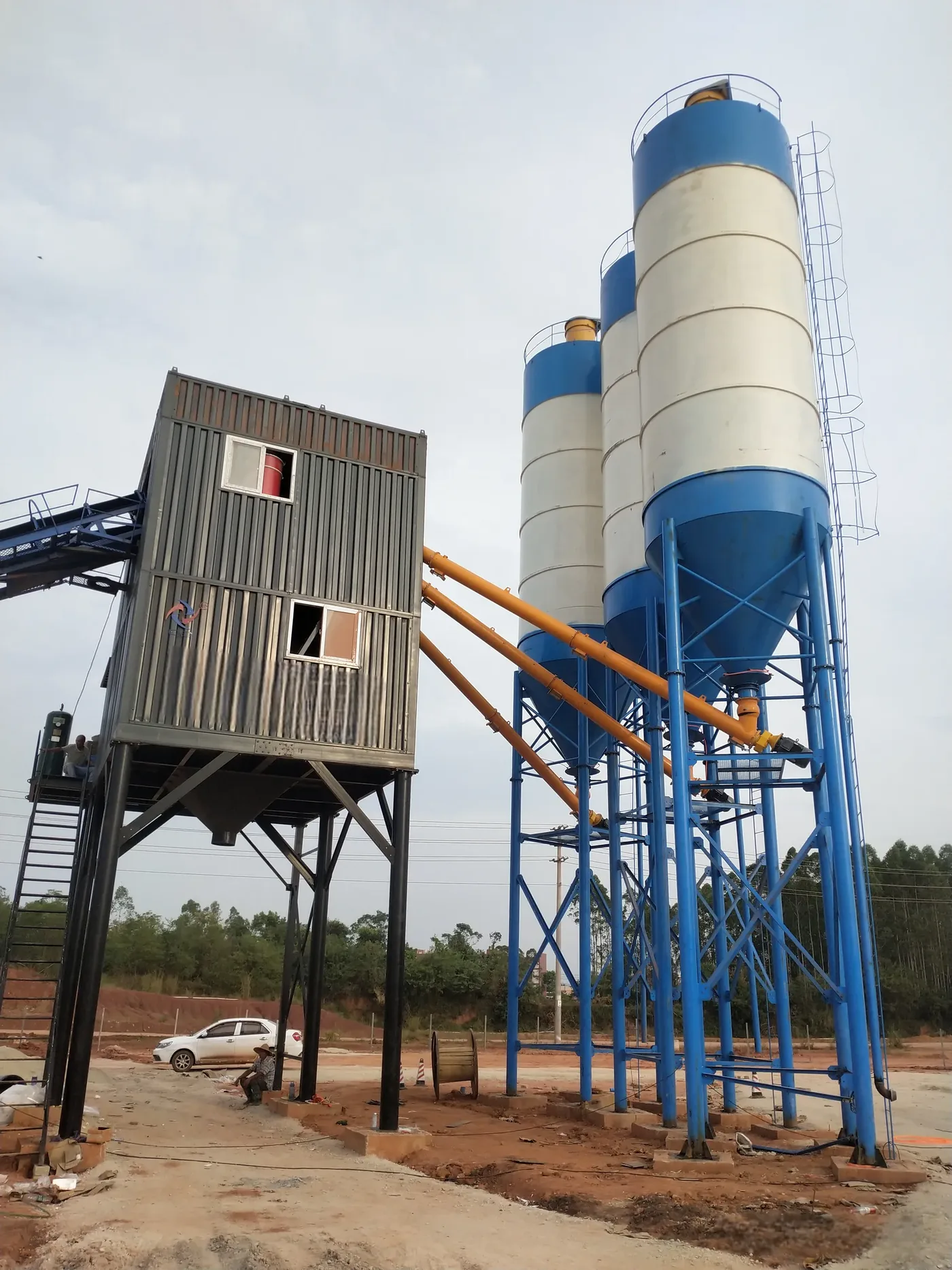 Box-type concrete mixing equipment, used to show how to control dust and noise for concrete batching plant related equipment and structures