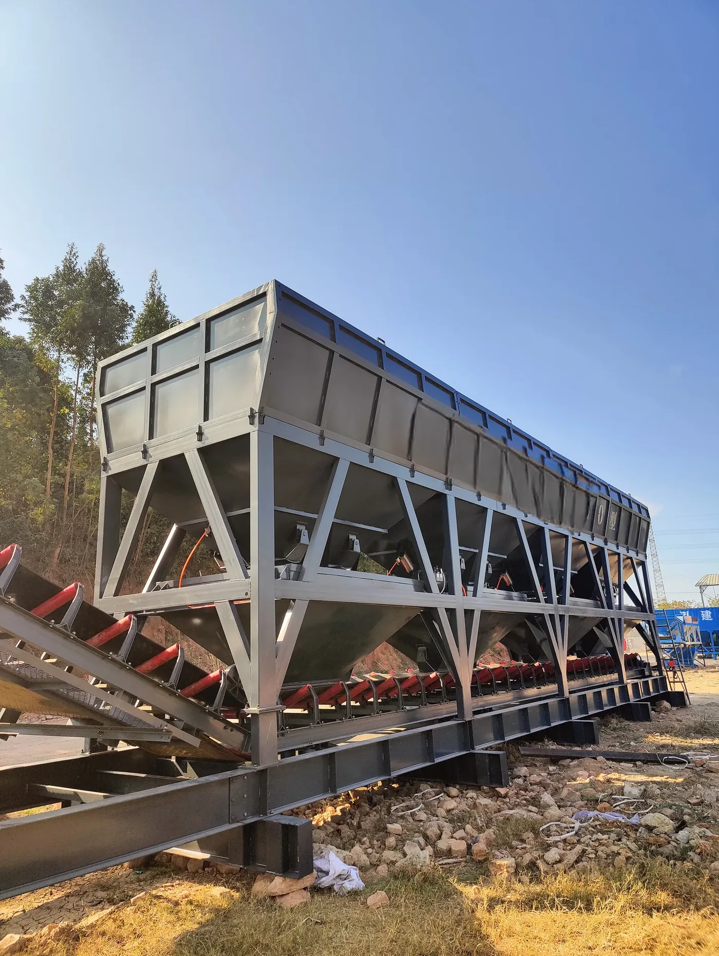 Modular batching, conveying, and mixing systems, used to display concrete batching plant solutions and project support related equipment and structures.
