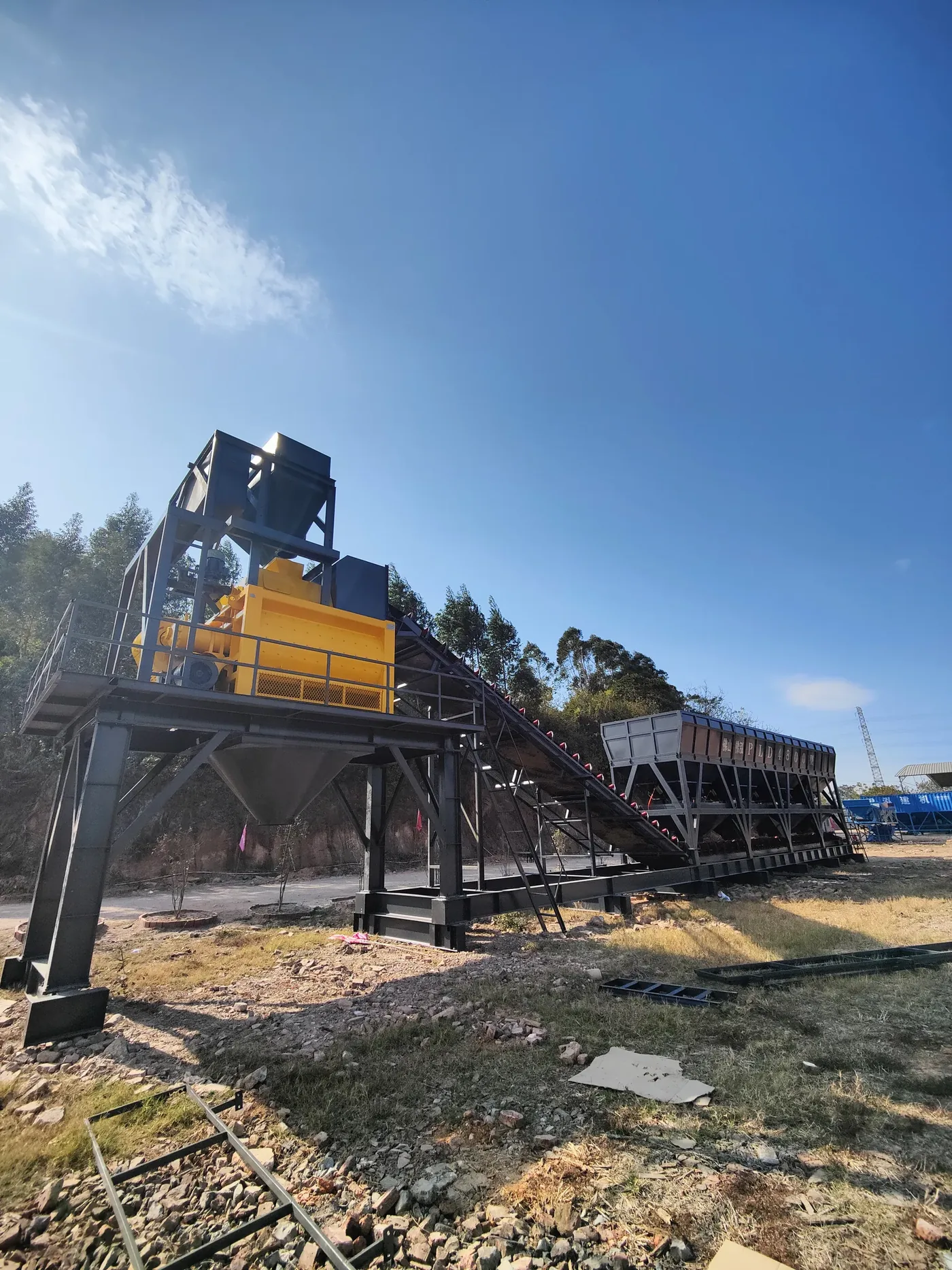 Modular batching, conveying, and mixing systems, used to display a comparison between horizontal and tower-style batching plant related equipment and structures.