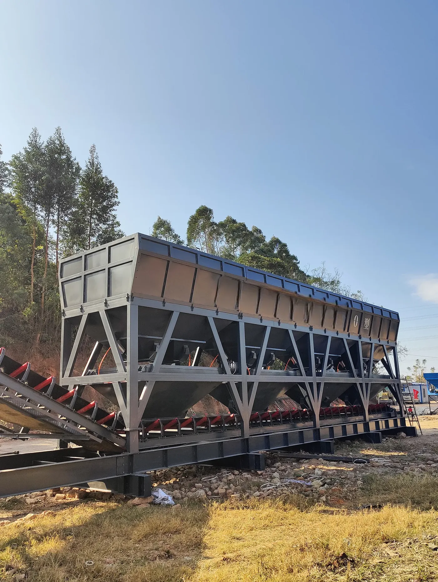 Modular batching, conveying, and mixing systems, used to display a comparison between horizontal and tower-style batching plant related equipment and structures.
