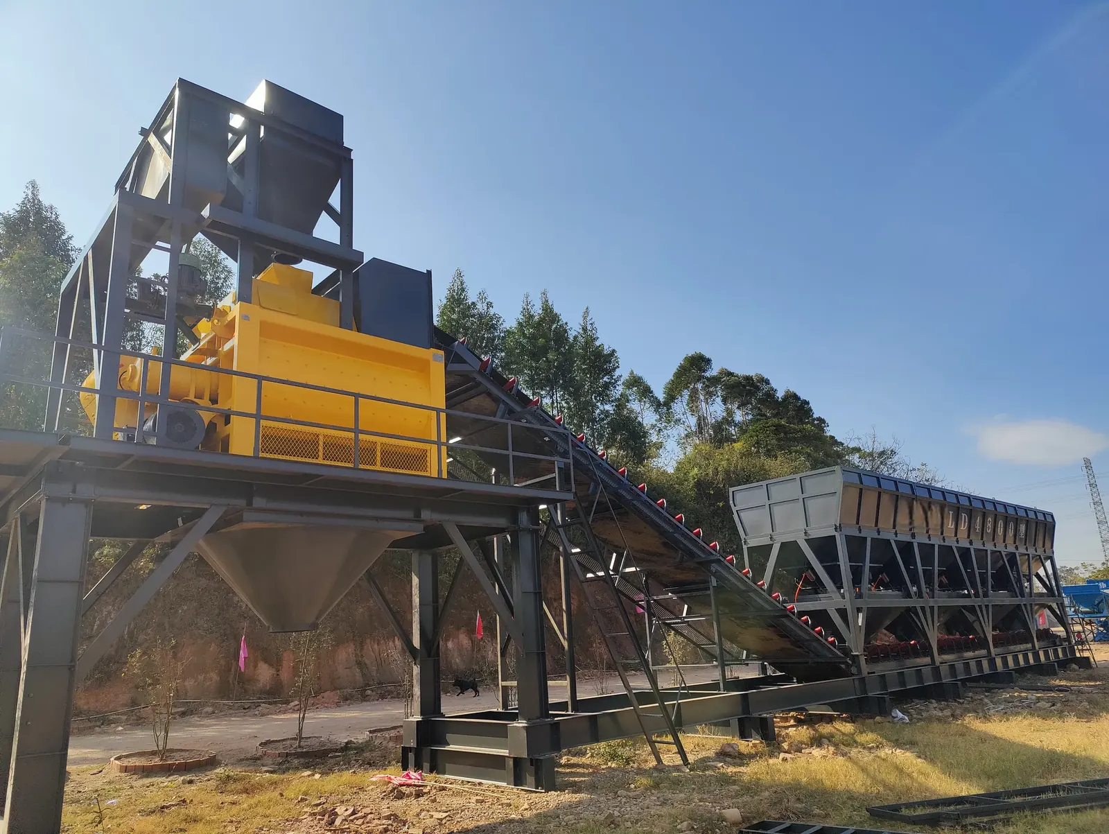 Reference live footage of batching, conveying, and mixing structures at modular project stations